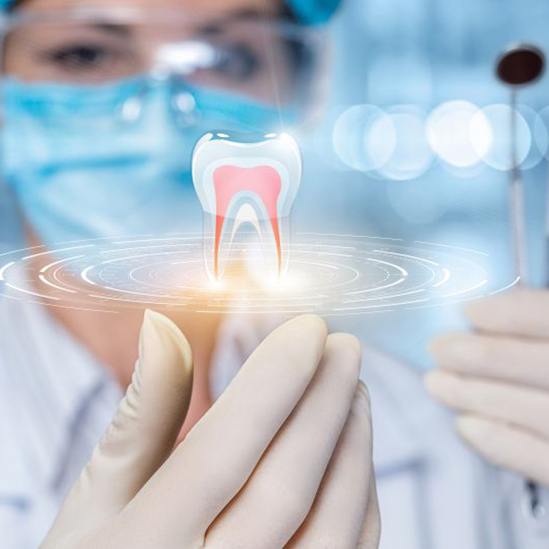 Digital image of tooth floating above dentist’s hand